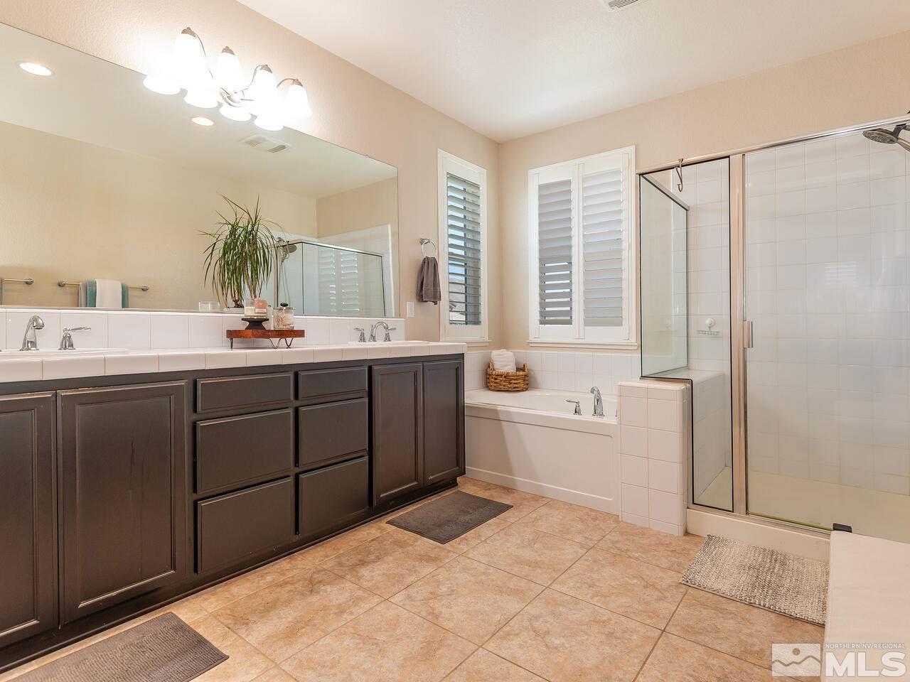 1985 Hope Valley Drive Reno, NV 89521 - Photo 13 of 19 a bathroom with a tub sink and mirror