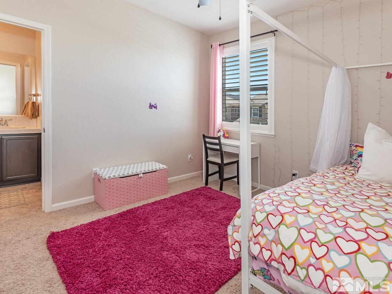 1985 Hope Valley Drive Reno, NV 89521 - Photo 16 of 19 a bedroom with a bed and a table in it with mirror