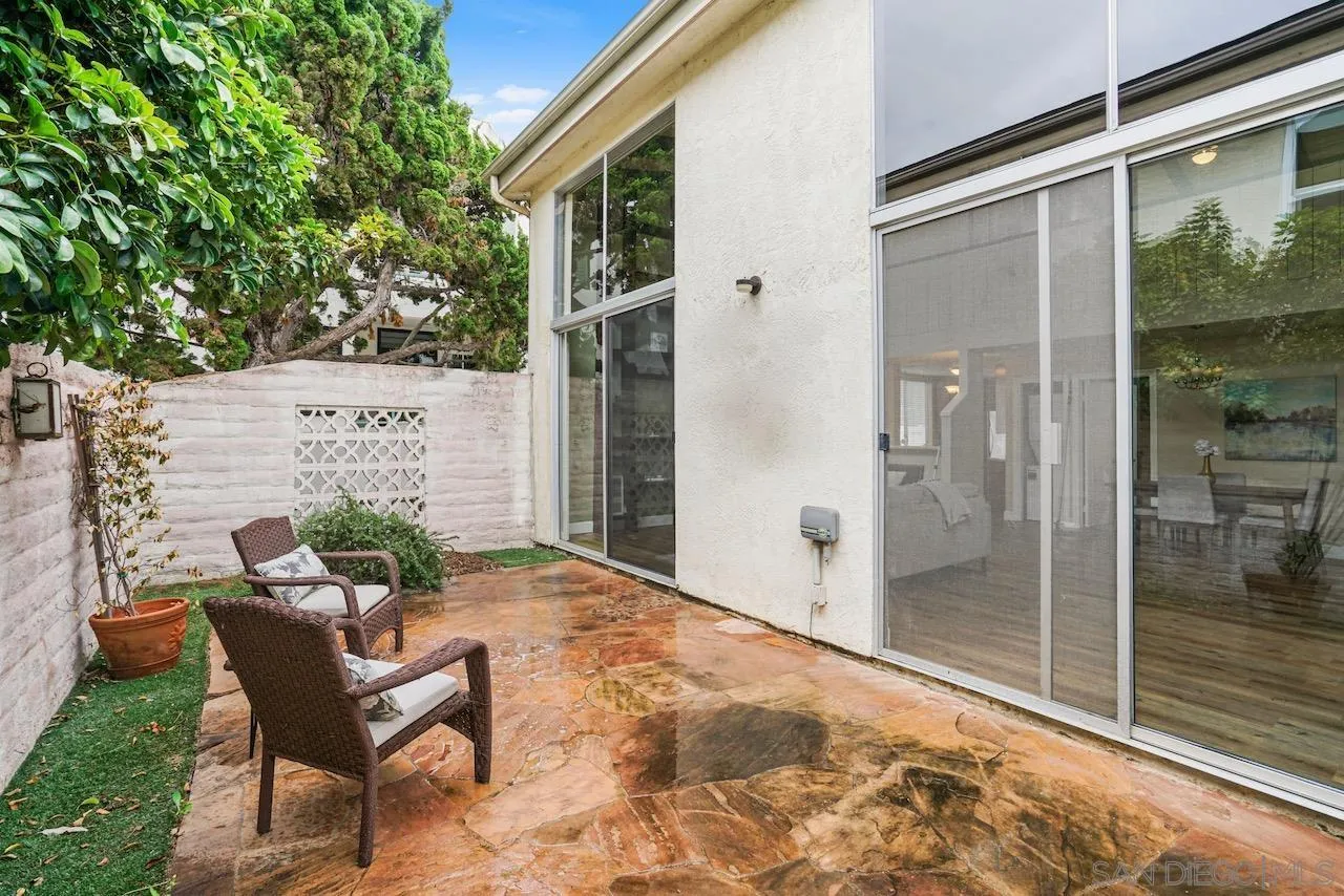 2544 Navarra Drive, Unit 5 Carlsbad, CA 92009 - Photo 11 of 39 a view of a chair and table in backyard of the house