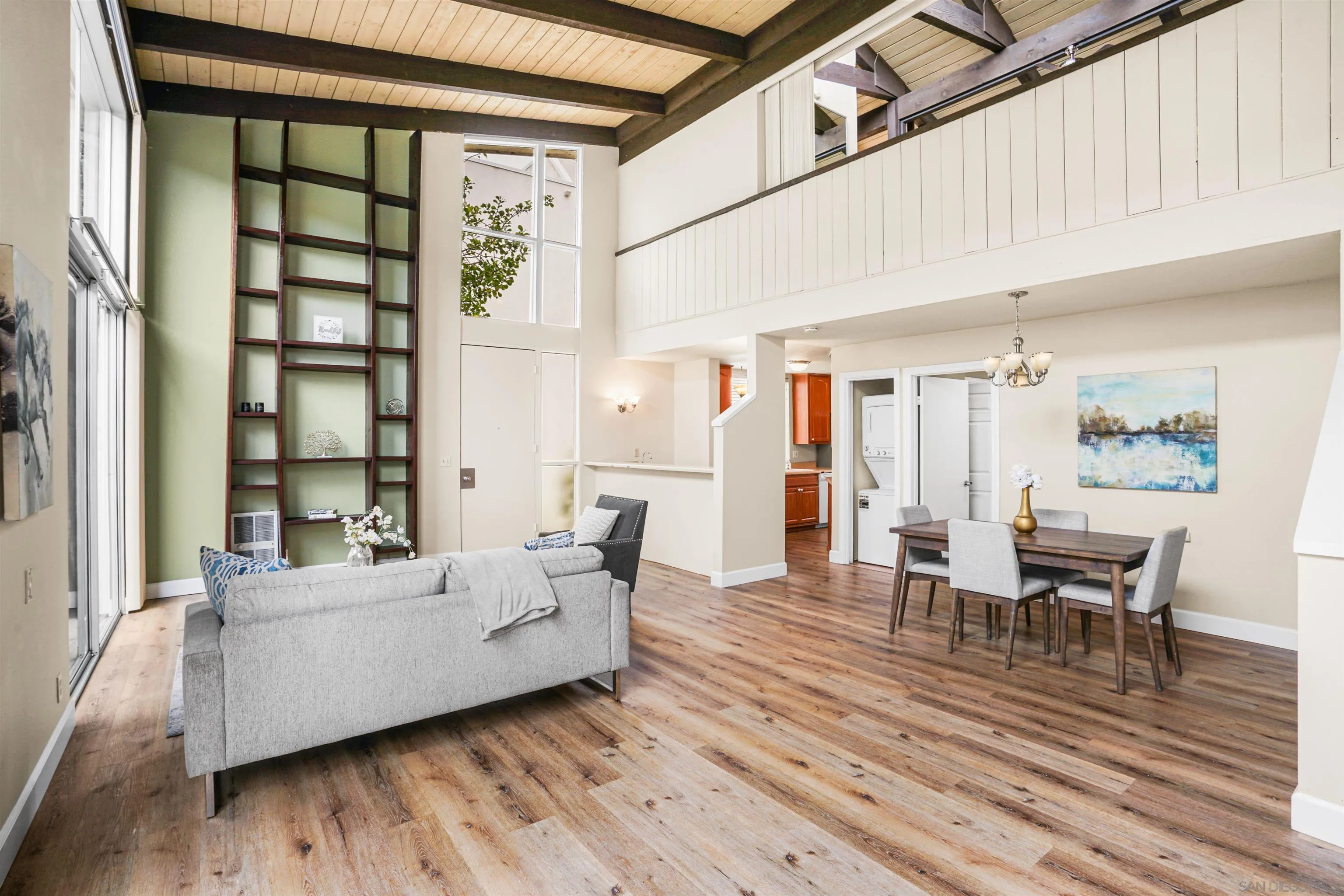 2544 Navarra Drive, Unit 5 Carlsbad, CA 92009 - Photo 12 of 39 a living room with furniture and wooden floor