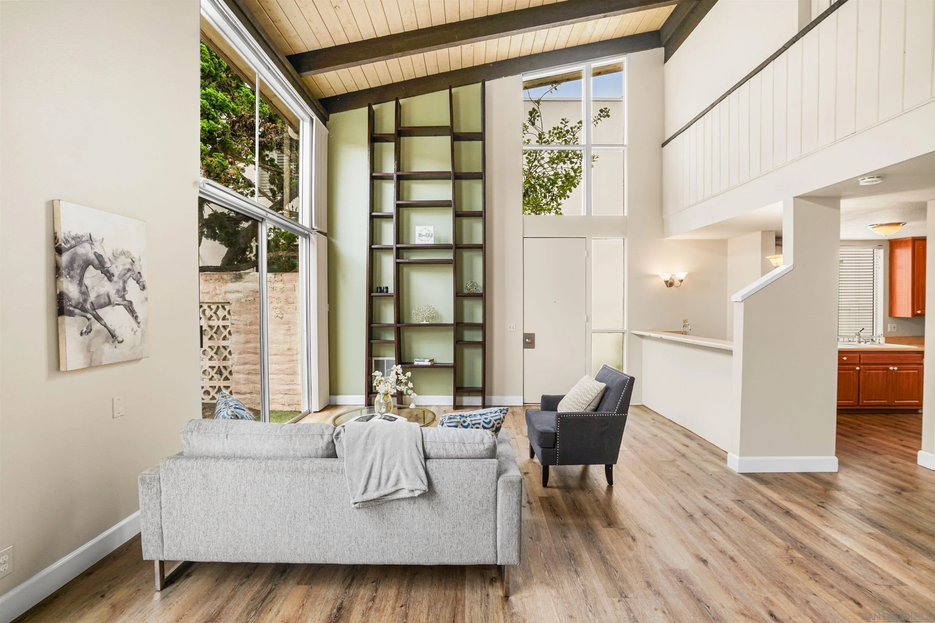 2544 Navarra Drive, Unit 5 Carlsbad, CA 92009 - Photo 14 of 39 a living room with furniture and a large window