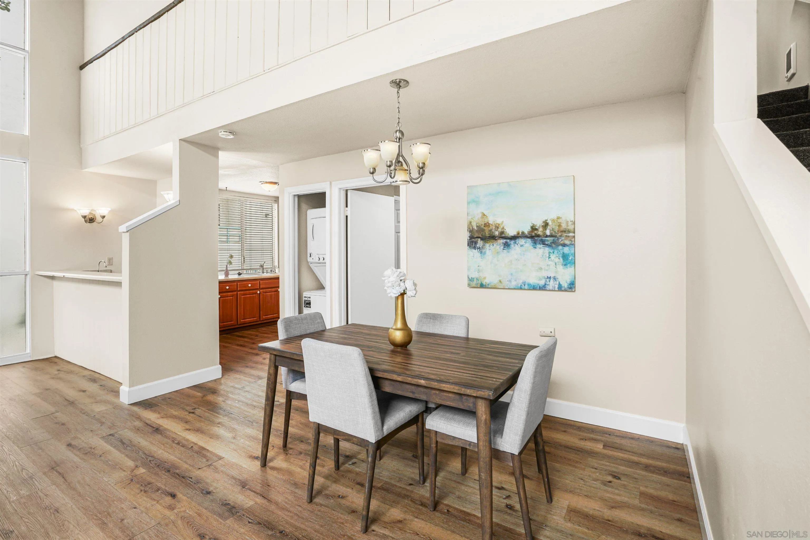 2544 Navarra Drive, Unit 5 Carlsbad, CA 92009 - Photo 21 of 39 a view of a dining room with furniture and wooden floor