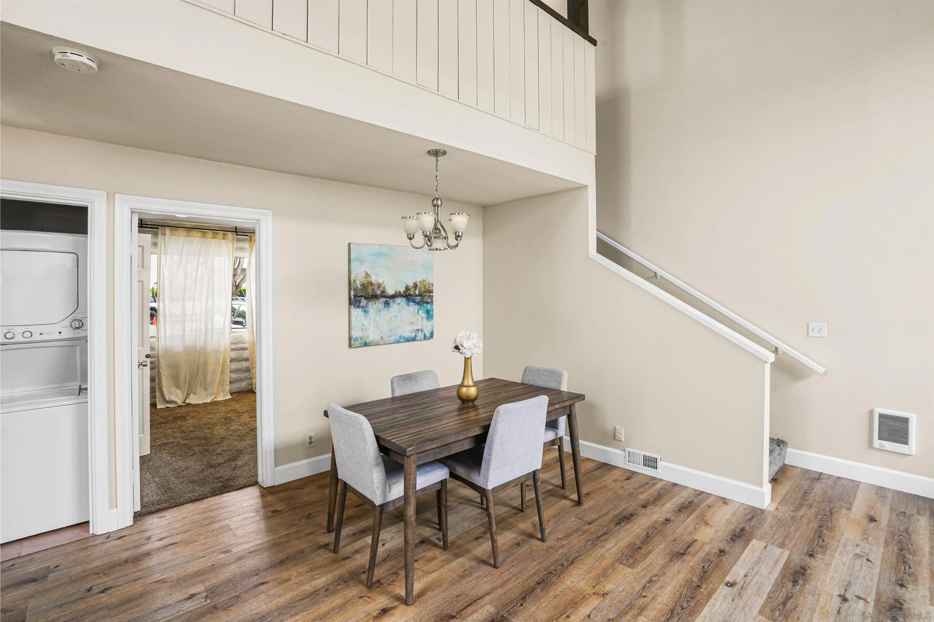 2544 Navarra Drive, Unit 5 Carlsbad, CA 92009 - Photo 22 of 39 a view of a dining room with furniture and wooden floor