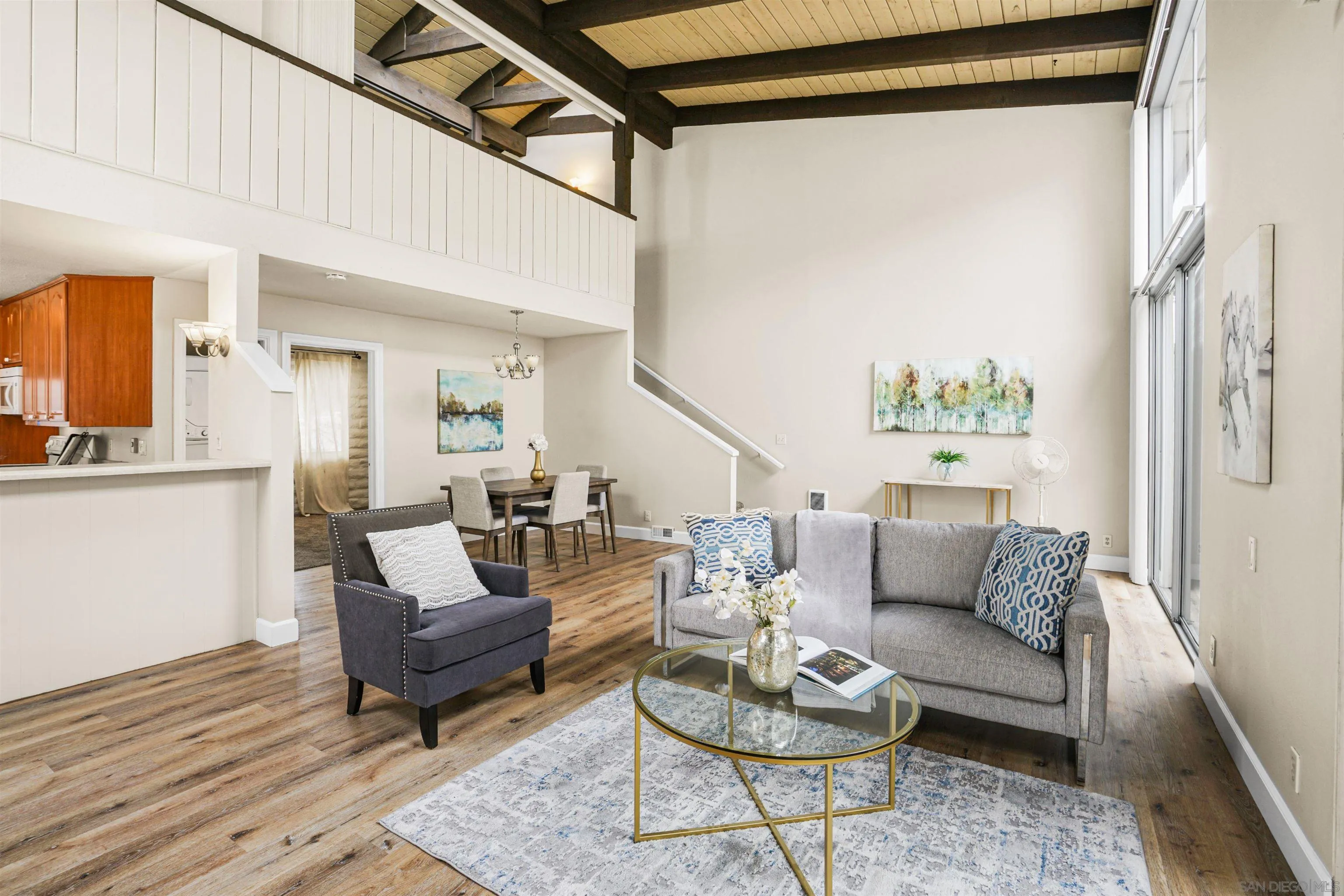 2544 Navarra Drive, Unit 5 Carlsbad, CA 92009 - Photo 23 of 39 a living room with furniture and a wooden floor