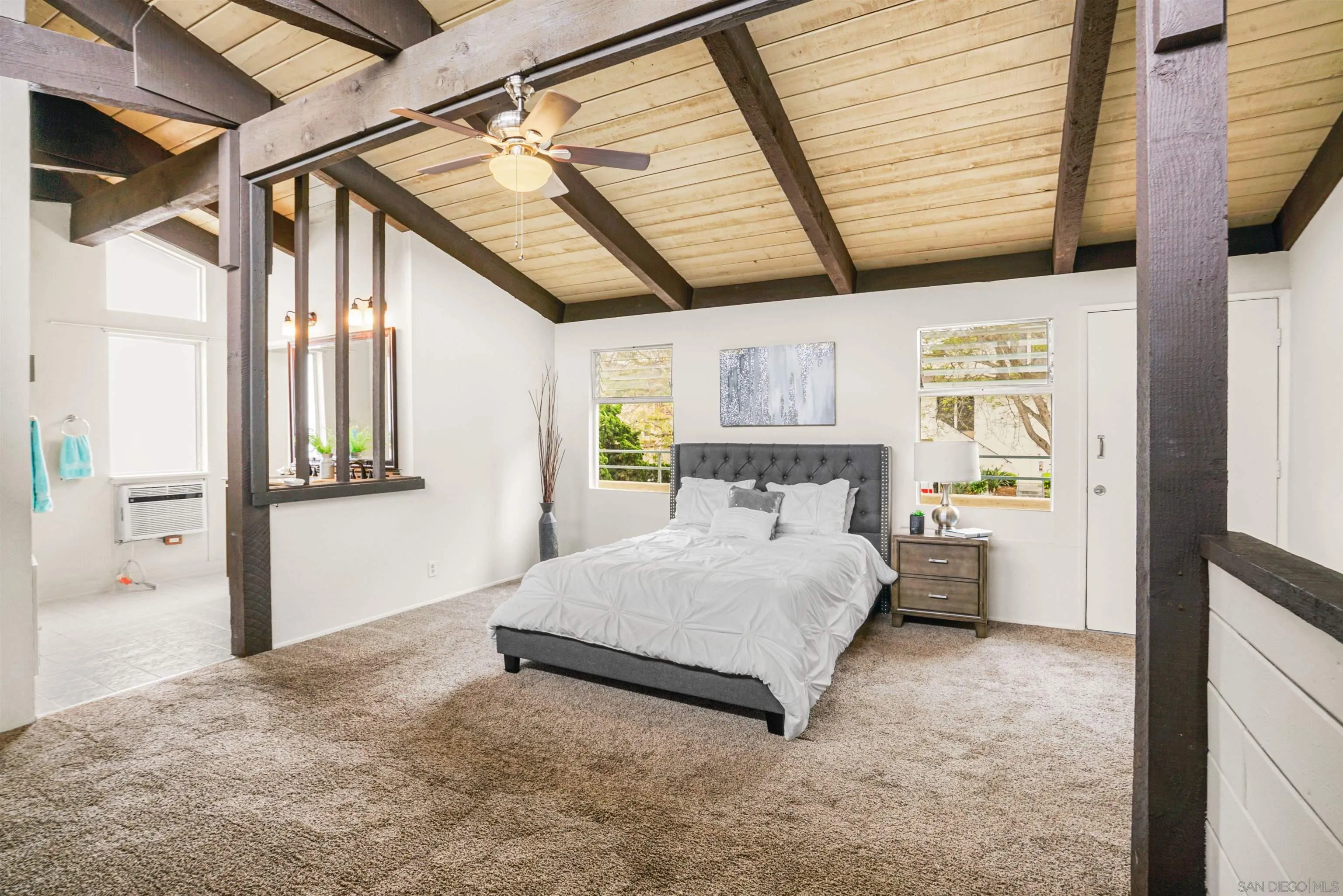 2544 Navarra Drive, Unit 5 Carlsbad, CA 92009 - Photo 24 of 39 a bedroom with a bed next to a window