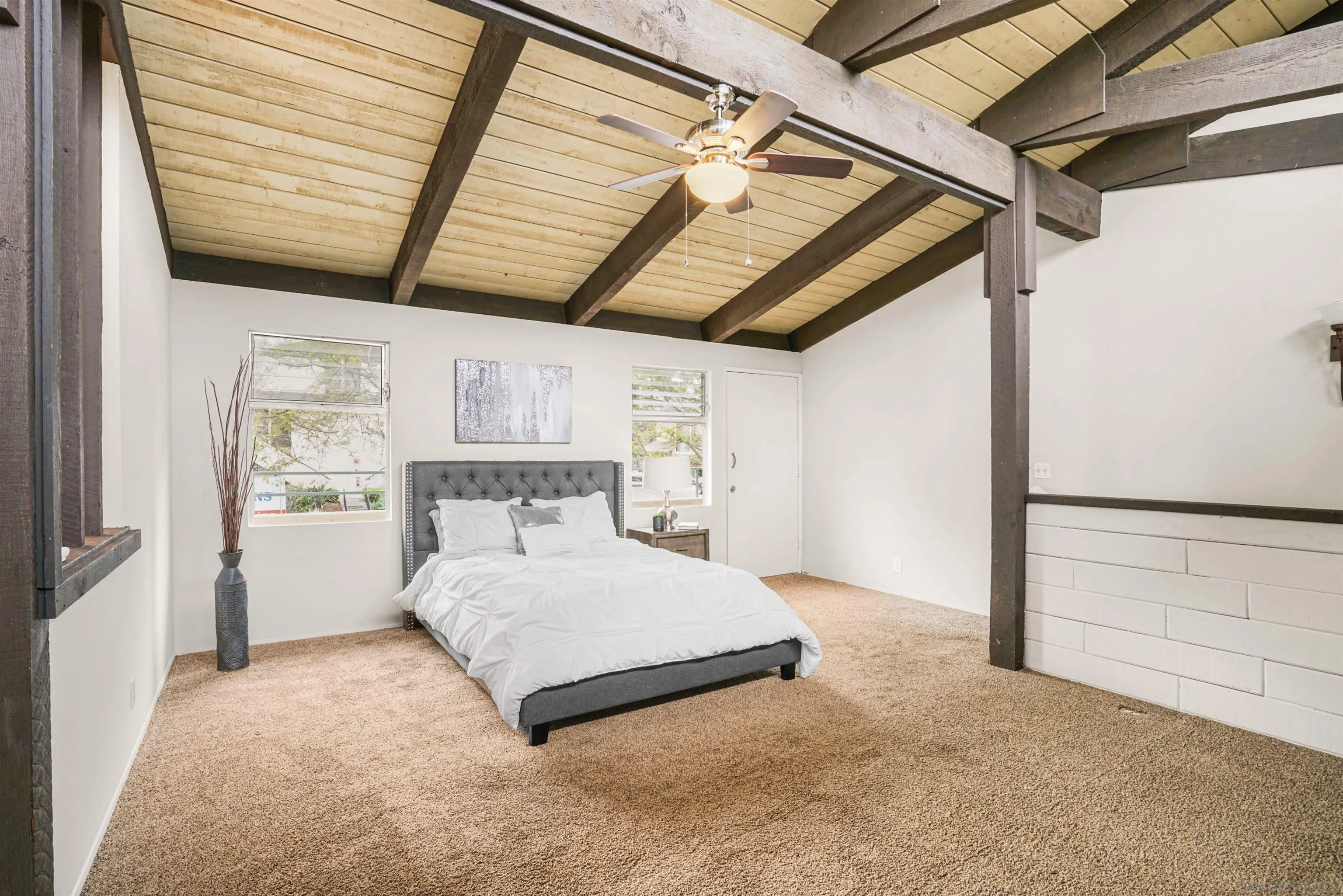 2544 Navarra Drive, Unit 5 Carlsbad, CA 92009 - Photo 25 of 39 a bedroom with a bed and a large window