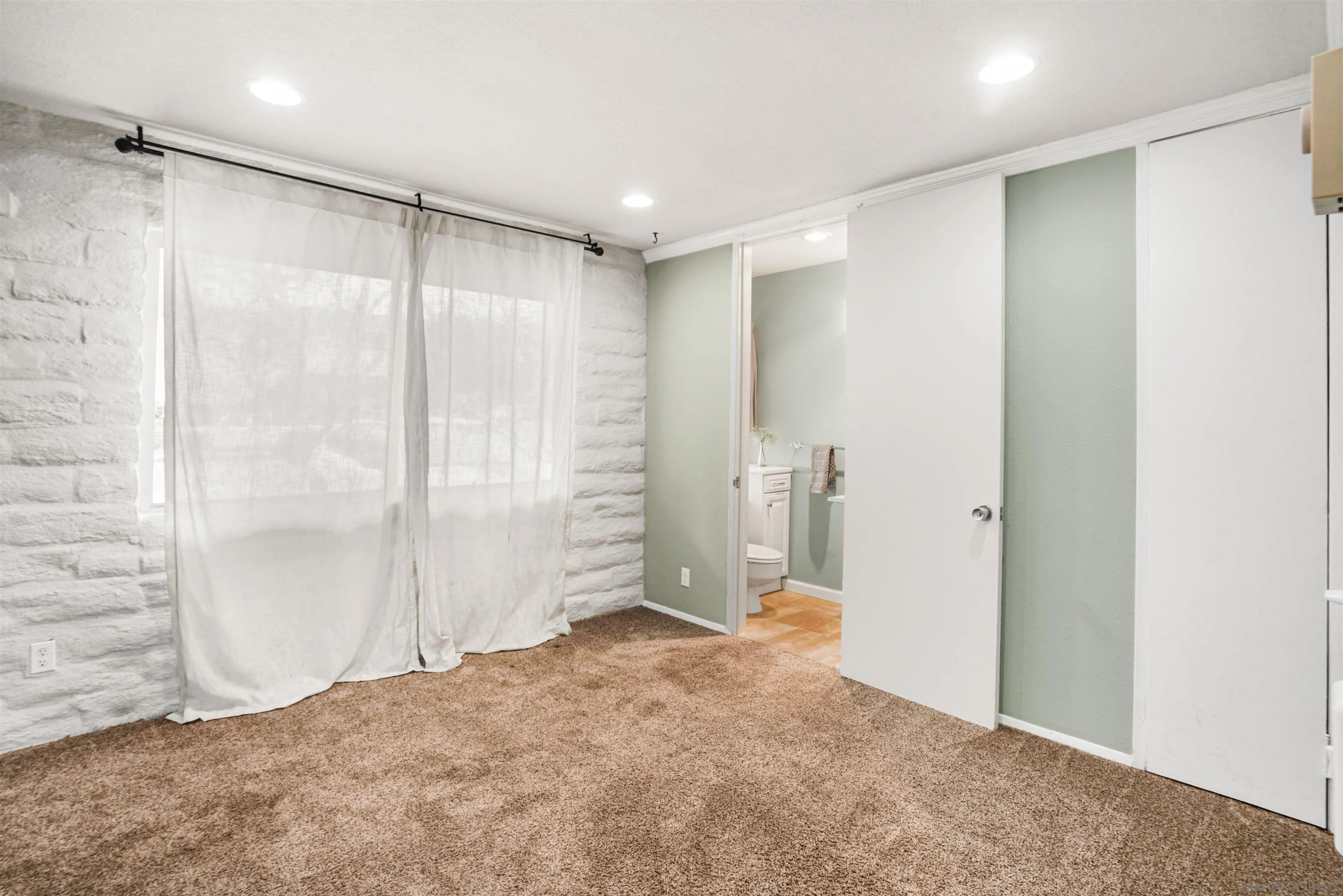 2544 Navarra Drive, Unit 5 Carlsbad, CA 92009 - Photo 33 of 39 a view of a bathroom with a shower and a sink