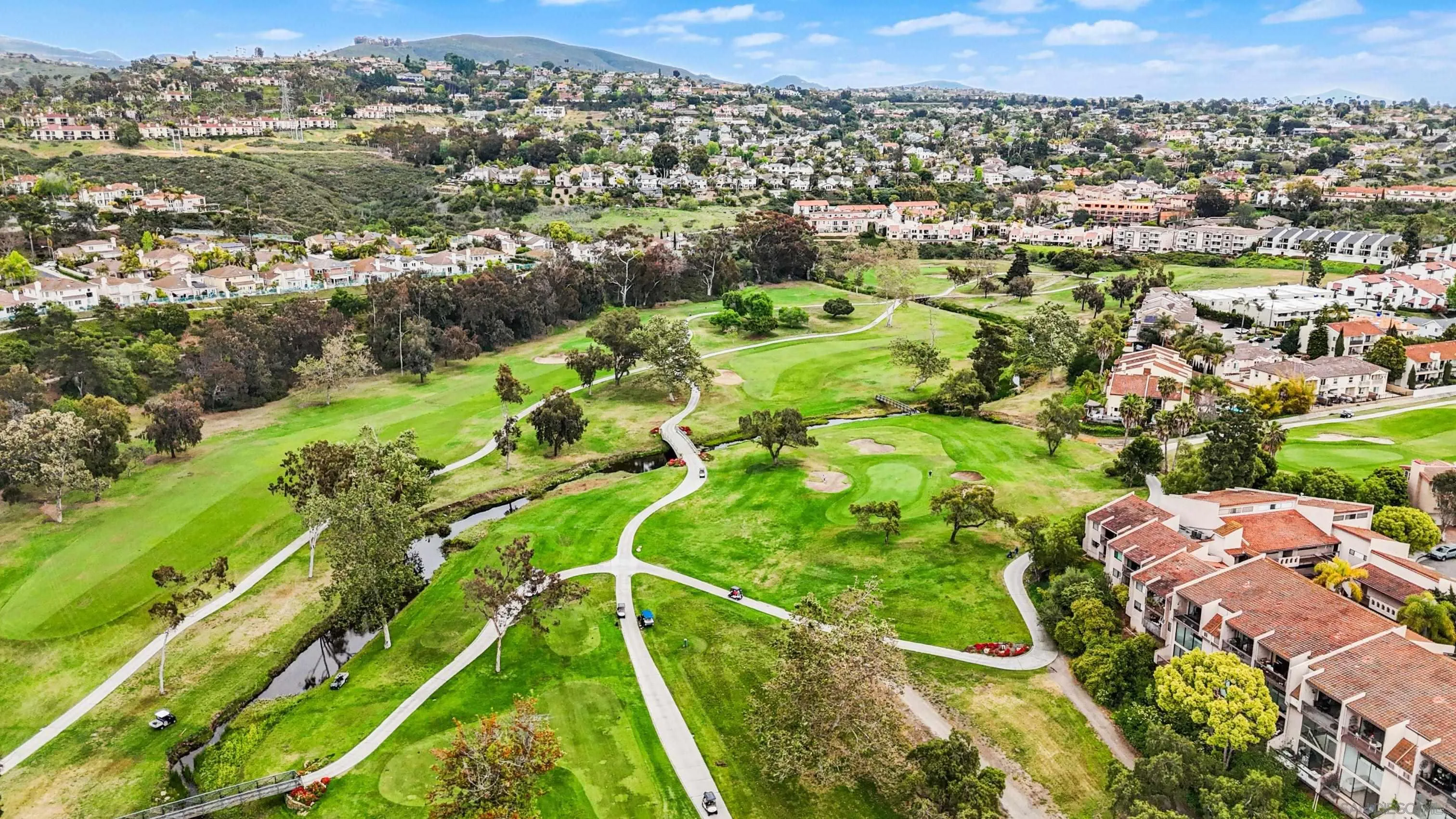 2544 Navarra Drive, Unit 5 Carlsbad, CA 92009 - Photo 34 of 39 an aerial view of residential houses with outdoor space and trees