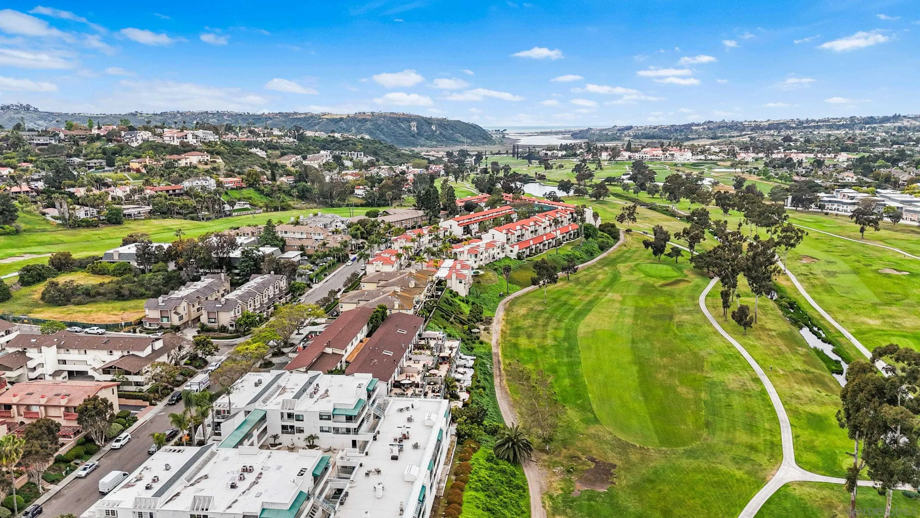 2544 Navarra Drive, Unit 5 Carlsbad, CA 92009 - Photo 37 of 39 an aerial view of residential houses with outdoor space
