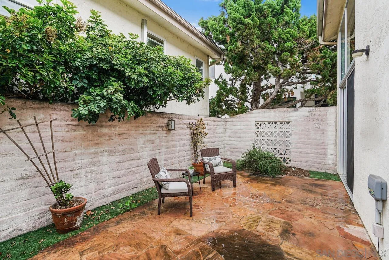 2544 Navarra Drive, Unit 5 Carlsbad, CA 92009 - Photo 6 of 39 a backyard of a house with seating space
