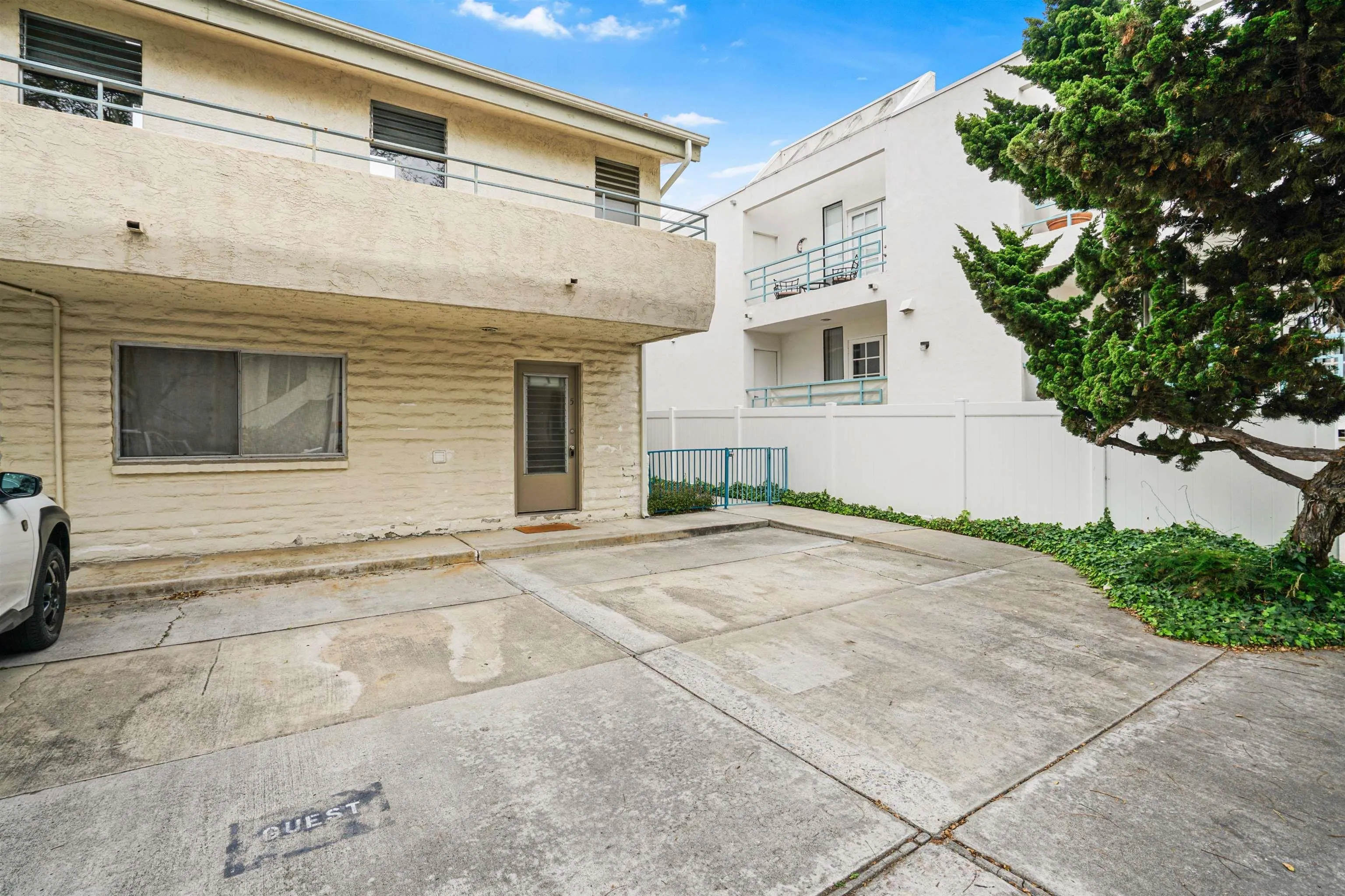 2544 Navarra Drive, Unit 5 Carlsbad, CA 92009 - Photo 10 of 39 a view of white house with a yard and garage
