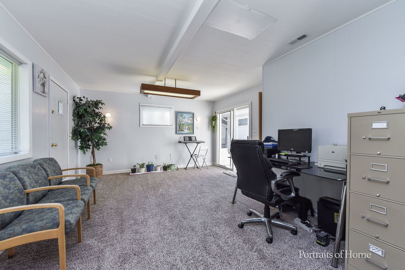 1426 Surrey Road Batavia, IL 60510 - Photo 8 of 13 a view of a workspace with furniture and a livingroom
