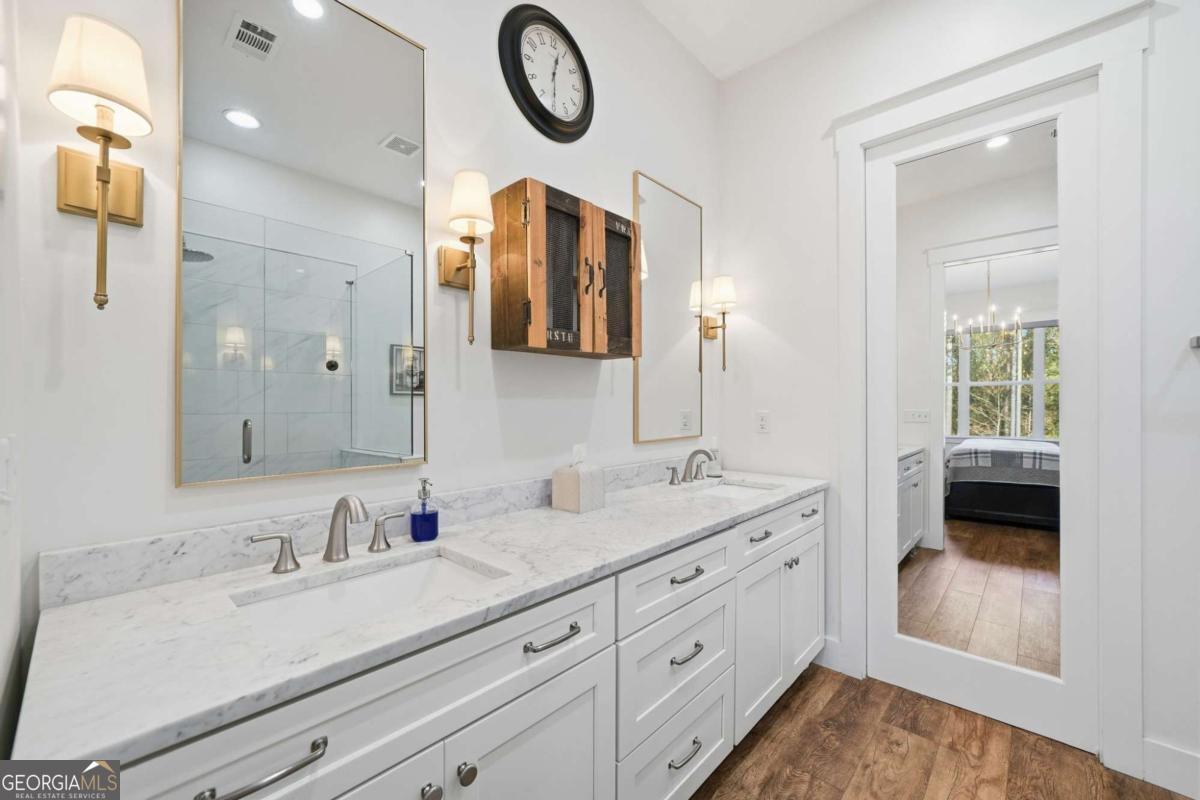 1950 Damascus Road Ball Ground, GA 30107 - Photo 12 of 29 a en suite bathroom with a double vanity sink and a mirror