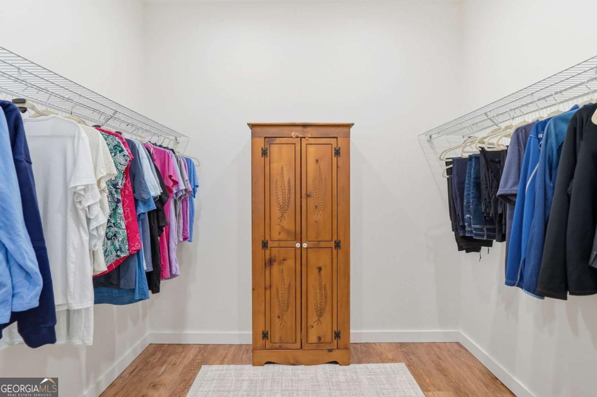 1950 Damascus Road Ball Ground, GA 30107 - Photo 14 of 29 a view of walk in closet with clothes