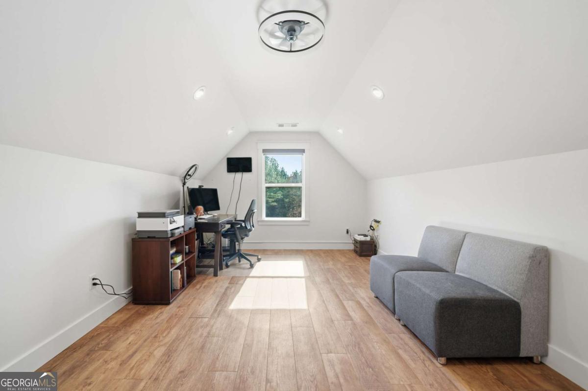 1950 Damascus Road Ball Ground, GA 30107 - Photo 15 of 29 a living room with furniture and a wooden floor