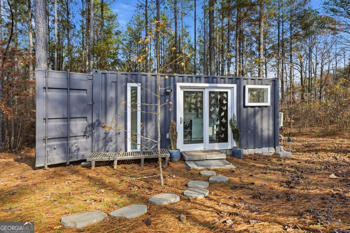1950 Damascus Road Ball Ground, GA 30107 - Photo 22 of 29 a view of a house with a yard