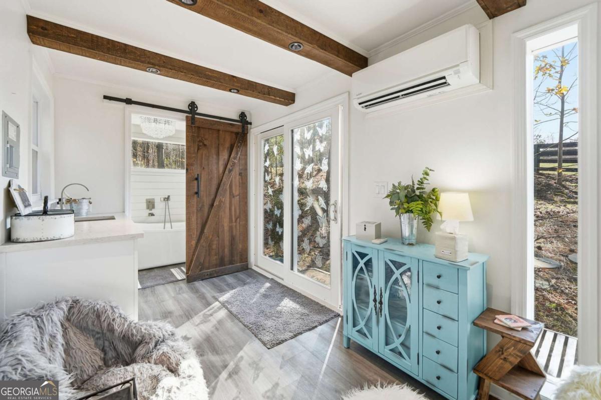 1950 Damascus Road Ball Ground, GA 30107 - Photo 24 of 29 a living room with furniture and a potted plant