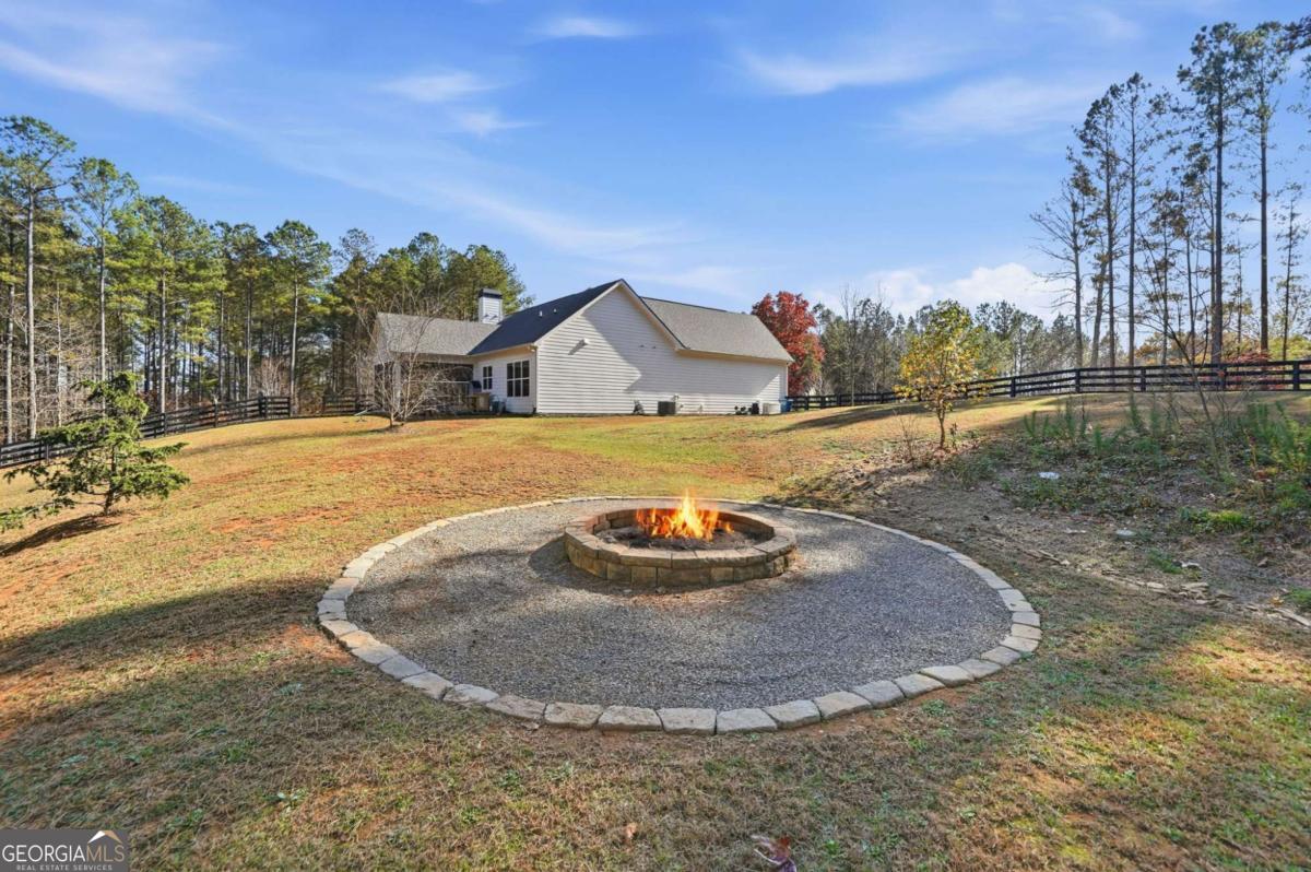 1950 Damascus Road Ball Ground, GA 30107 - Photo 26 of 29 a view of a house with a yard