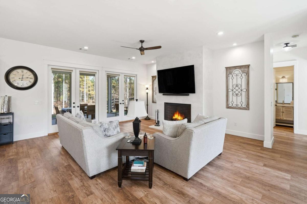 1950 Damascus Road Ball Ground, GA 30107 - Photo 7 of 29 a living room with furniture a fireplace and a flat screen tv