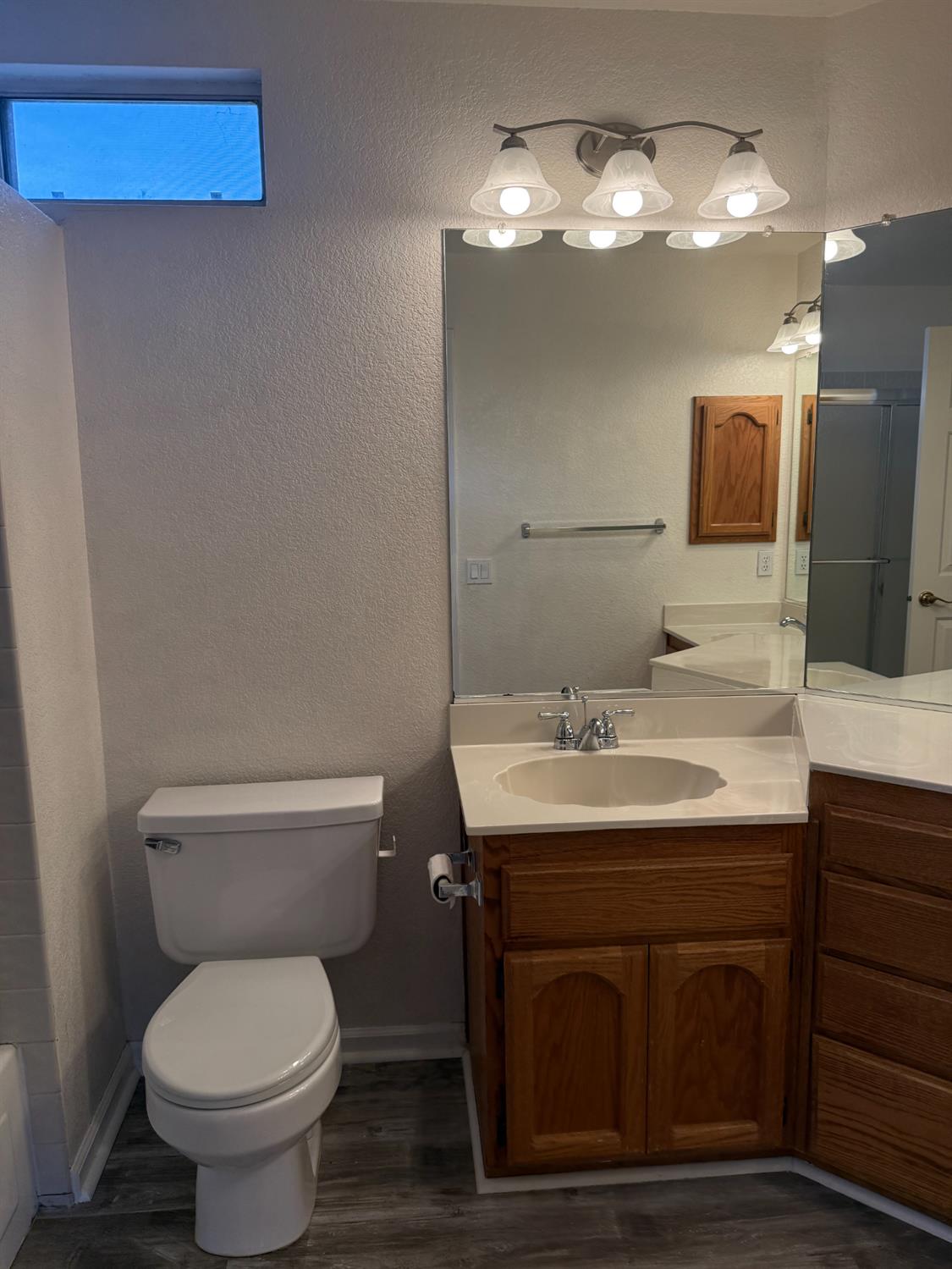 1004 Shasta Avenue Modesto, CA 95358 - Photo 22 of 37 a bathroom with a sink and a toilet