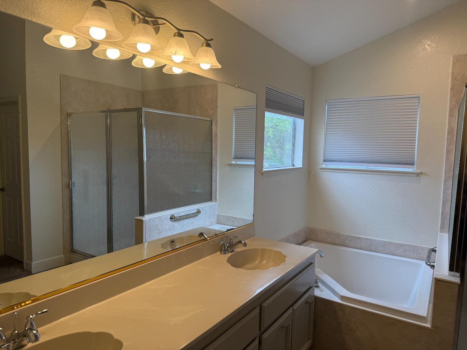 1004 Shasta Avenue Modesto, CA 95358 - Photo 28 of 37 a bathroom with a sink and a bathtub