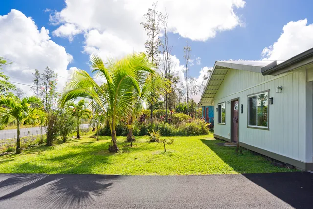 a view of a porch with furniture and garden