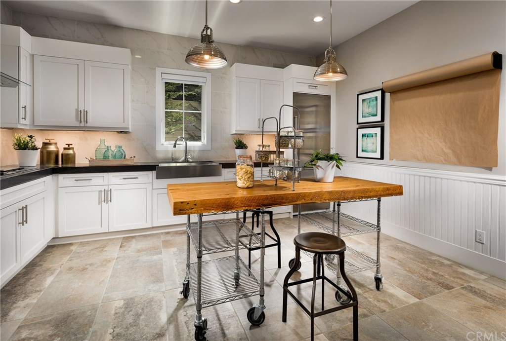 128 Interstellar Irvine, CA 92618 - Photo 7 of 13 Back Kitchen. Photo of model home not actual home for sale. Home is still under Construction.