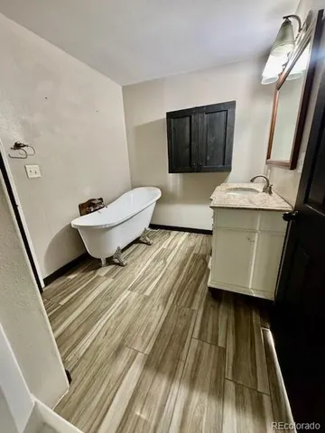 a living room with a couch and a rug