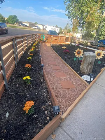 a view of kitchen with microwave and refrigerator