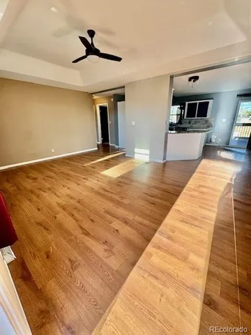 a view of a kitchen with wooden floor