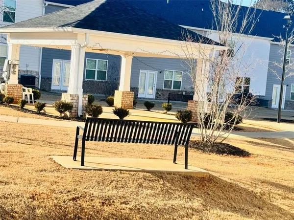 a balcony with table and chairs