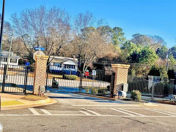 a view of a street with brick building in the background