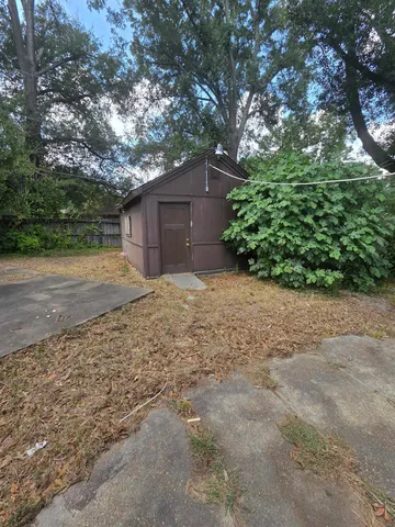 a big yard with large trees