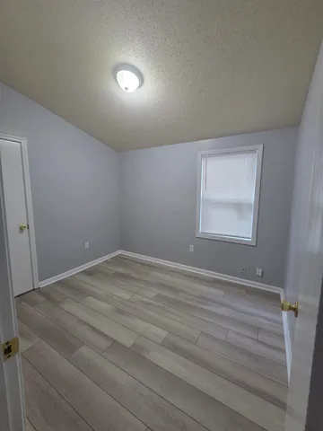 a room with a bed and a window