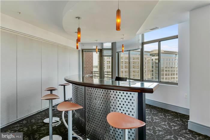 3600 South Glebe Road, Unit 601W Arlington, VA 22202 - Photo 21 of 23 a view of a room that has a table and chairs in it