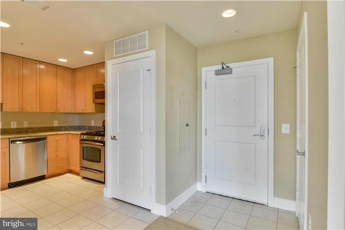 3600 South Glebe Road, Unit 601W Arlington, VA 22202 - Photo 5 of 23 a kitchen with stainless steel appliances granite countertop a refrigerator and a sink