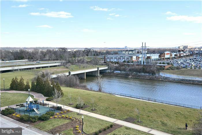 3600 South Glebe Road, Unit 601W Arlington, VA 22202 - Photo 8 of 23 a view of a lake with a yard