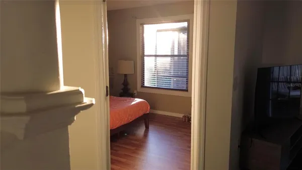 a bed room with a bed and a window