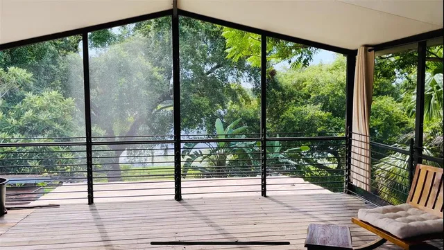 a view of a room with wooden floor and furniture