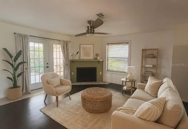 a living room with furniture and a fireplace