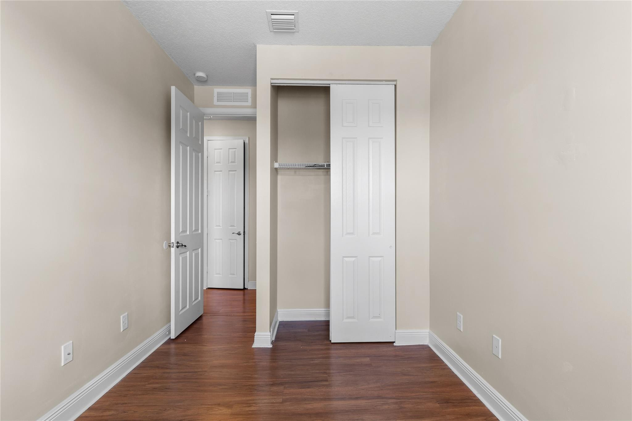 6918 Long Pine Circle Coconut Creek, FL 33073 - Photo 12 of 19 a view of empty room with wooden floor