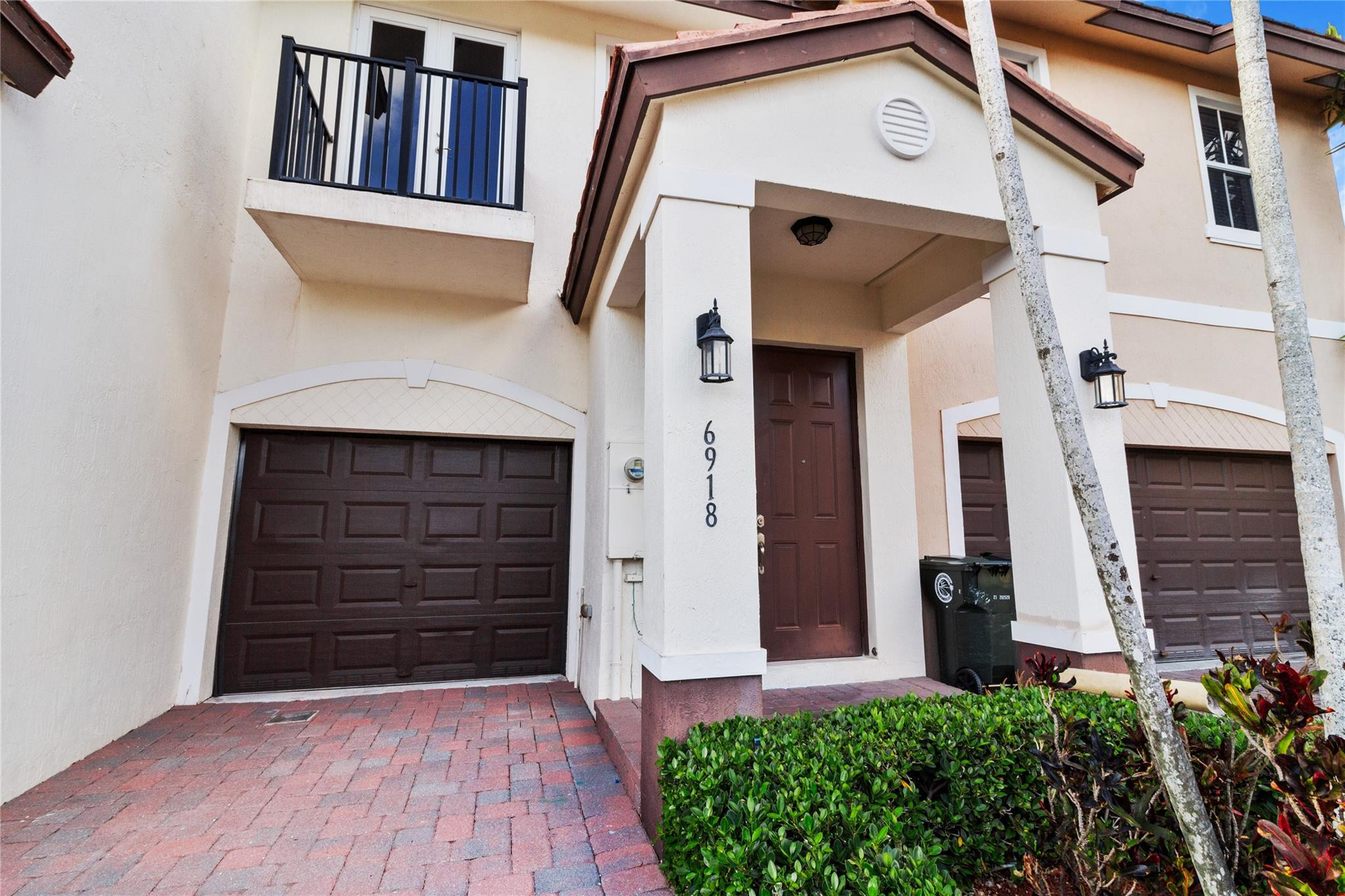 6918 Long Pine Circle Coconut Creek, FL 33073 - Photo 2 of 19 a view of a house with door and wooden door