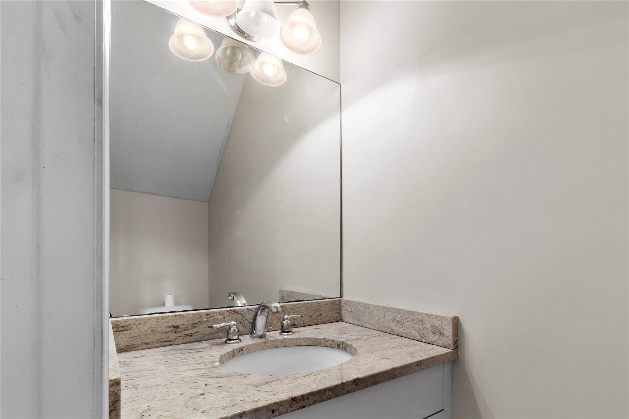 6918 Long Pine Circle Coconut Creek, FL 33073 - Photo 4 of 19 a bathroom with a granite countertop sink and a mirror