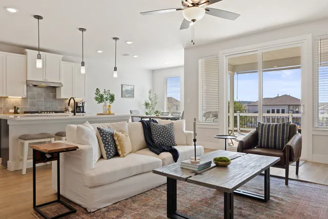 a living room with furniture and a large window