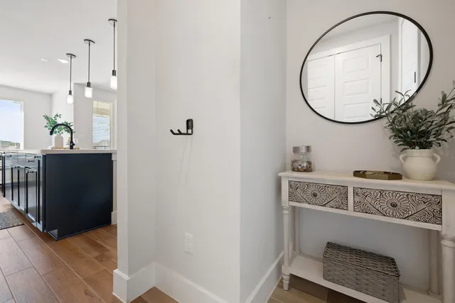 a view of a livingroom with a sink and a mirror