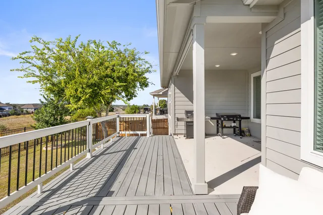 a swimming pool with a tree in the background