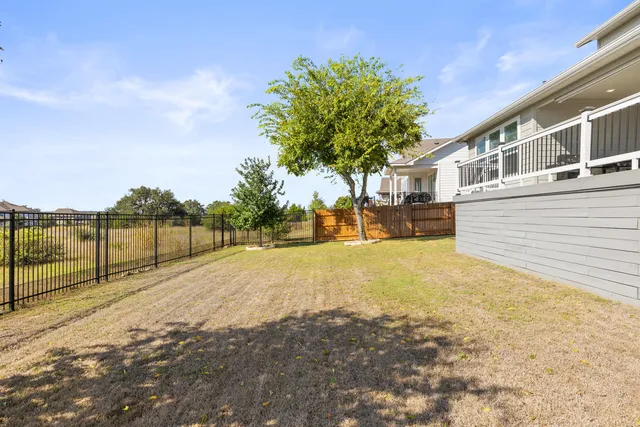 a view of a house with swimming pool and sitting area