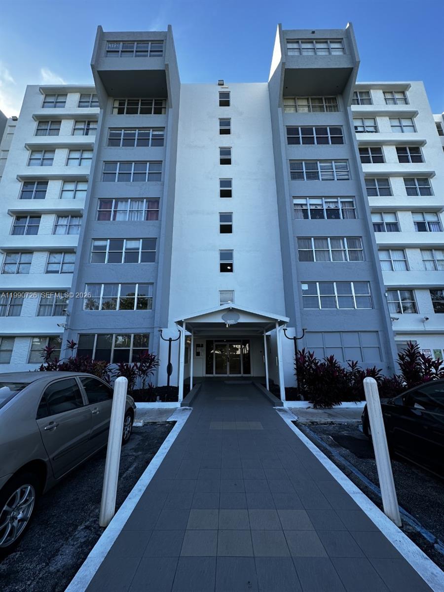 9001 Southwest 77th Avenue, Unit C604 Miami, FL 33156 - Photo 1 of 17 a view of a building with many windows
