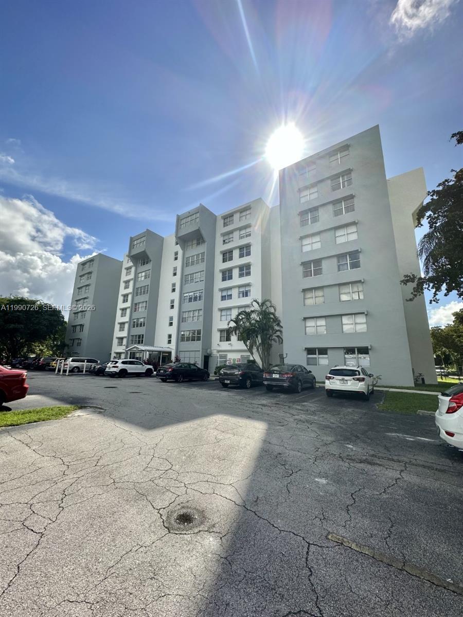 9001 Southwest 77th Avenue, Unit C604 Miami, FL 33156 - Photo 16 of 17 a view of a building with outdoor space