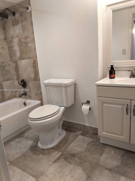 9001 Southwest 77th Avenue, Unit C604 Miami, FL 33156 - Photo 9 of 17 a bathroom with a toilet sink and mirror